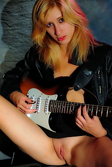 Carol O in My Guitar by Alana H indoor blonde blue eyes shav...